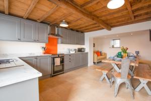 a kitchen with a table and a dining room at 3 Bed in Askrigg oc-ds1049 in Askrigg