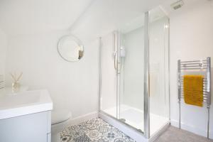 a white bathroom with a shower and a toilet at 3 Bed in Askrigg oc-ds1049 in Askrigg +15 photos