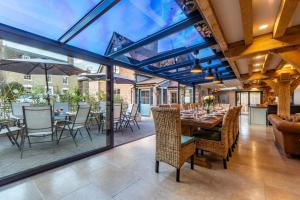a dining room with a table and chairs at 5 Bed in Frampton On Severn oc-d29489 in Frampton on Severn
