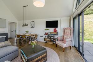 a living room with a couch and a table at 2 Bed in Newburgh oc-g32594 in Newburgh