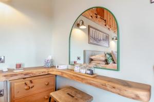 a dressing room with a wooden counter and a mirror at 1 Bed in Whitbourne oc-s32935 in Whitbourne