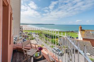 a balcony with a view of the beach at 3 Bed in Woolacombe oc-d32422 in Woolacombe