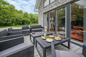 a patio with a table with food on it at 4 Bed in Retorrick Mill oc-t28899 in Saint Mawgan