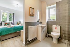 a bathroom with a bed and a toilet in it at 4 Bed in Retorrick Mill oc-t28899 in Saint Mawgan +20 photos
