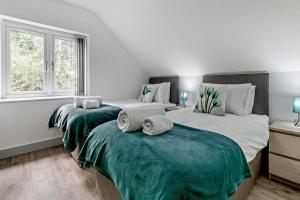 a bedroom with two beds and a window at 4 Bed in Retorrick Mill oc-t28899 in Saint Mawgan