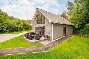 a small house with a patio in the grass at 4 Bed in Retorrick Mill oc-t28899 in Saint Mawgan