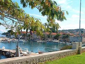 a body of water with boats in a harbor at Apartments on Gorana Pavlova 24 in Sutivan