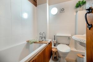 a white bathroom with a toilet and a sink at 4 Bed in Heywood oc-t29040 in Westbury +14 photos