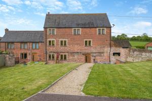 an old brick house with a grassy yard in front of it at 4 Bed in Heywood oc-t29040 in Westbury