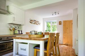 a kitchen with a kitchen island with wooden counter tops at 2 Bed in Kelling oc-1716 in Kelling +5 photos