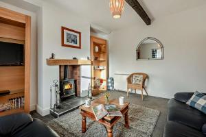 a living room with a couch and a fireplace at 3 Bed in Bowness-on-Solway oc-p28797 in Bowness-on-Solway