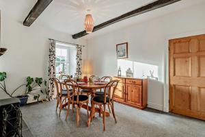a dining room with a wooden table and chairs at 3 Bed in Bowness-on-Solway oc-p28797 in Bowness-on-Solway