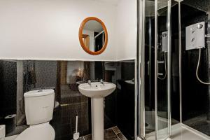 a bathroom with a toilet and a sink and a mirror at 3 Bed in Bowness-on-Solway oc-p28797 in Bowness-on-Solway +9 photos