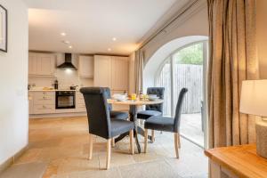 a kitchen and dining room with a table and chairs at 2 Bed in Crakehall oc-m30355 in Crakehall