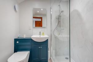 a bathroom with a toilet and a sink and a shower at 2 Bed in Crakehall oc-m30355 in Crakehall +18 photos