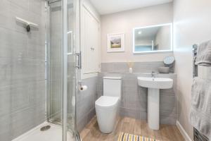 a bathroom with a toilet and a sink and a shower at 2 Bed in Braithwaite oc-p31730 in Braithwaite