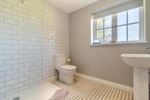 a bathroom with a toilet and a sink and a window at 2 Bed in Oxborough oc-r29291 in Oxborough +14 photos