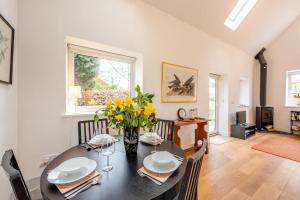 a dining room with a table with yellow flowers on it at 2 Bed in Battle oc-c31781 in Battle +10 photos