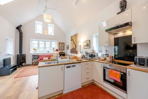 a kitchen with white cabinets and a large open floor plan at 2 Bed in Battle oc-c31781 in Battle