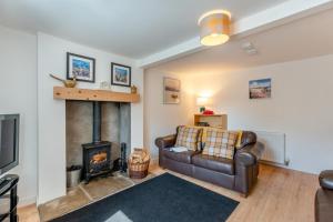 a living room with a couch and a fireplace at 3 Bed in Coldingham oc-b29846 in Coldingham