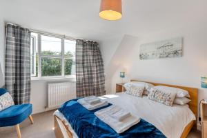 a bedroom with a bed and a window at 3 Bed in Coldingham oc-b29846 in Coldingham