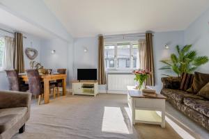a living room with a couch and a table at 2 Bed in Bush oc-h31848 in Bude