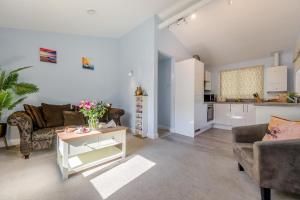 a living room with a couch and a table at 2 Bed in Bush oc-h31848 in Bude