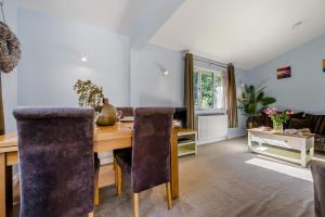 a dining room with a wooden table and chairs at 2 Bed in Bush oc-h31848 in Bude +21 photos