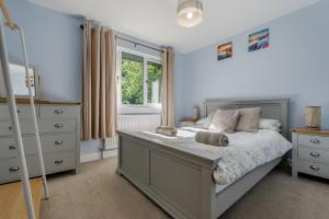 a bedroom with a bed and a window at 2 Bed in Bush oc-h31848 in Bude