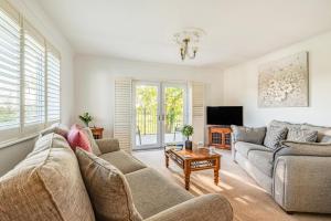 a living room with two couches and a tv at 3 Bed in Longtown oc-h30069 in Longtown