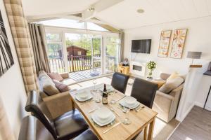 a dining room with a table and a couch at 2 Bed in Felton oc-w30642 in Felton