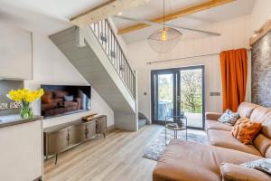 a living room with a couch and a tv at 1 Bed in Berriew oc-a31113 in Berriew
