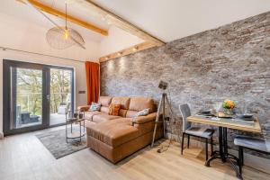 a living room with a couch and a table at 1 Bed in Berriew oc-a31113 in Berriew