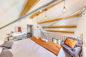 a bedroom with a large bed and a chair at 1 Bed in Berriew oc-a31113 in Berriew