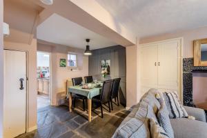 a kitchen and dining room with a table and chairs at 2 Bed in Field Broughton oc-l31021 in Cartmel