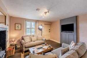 a living room with two couches and a tv at 2 Bed in Field Broughton oc-l31021 in Cartmel