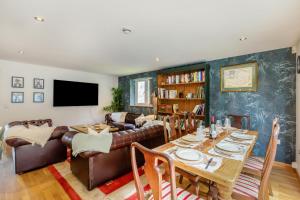 a living room with a table and a couch at 2 Bed in West Quantoxhead oc-p30893 in West Quantoxhead