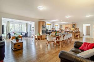 a living room and kitchen with a table and chairs at 5 Bed in Pentney oc-w27337 in Pentney
