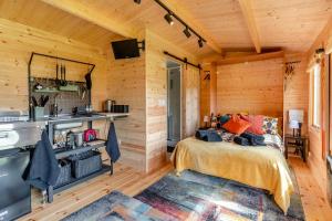 a bedroom with a bed in a wooden cabin at 1 Bed in Cilycwm oc-t29297 in Cilycwm