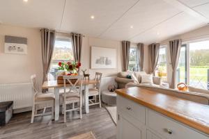 a kitchen and living room with a table and a couch at 2 Bed in Sewerby oc-s31941 in Sewerby