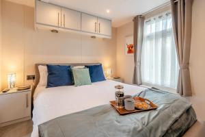 a bedroom with a bed with a tray of food on it at 2 Bed in Sewerby oc-s31941 in Sewerby