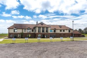 a large brick building with signs in front of it at 2 Bed in Sewerby oc-s31941 in Sewerby