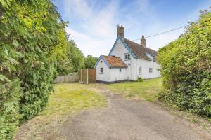 an empty road leading to a white house at 3 Bed in Stowupland oc-p32216 in Stowmarket