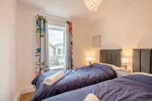 a bedroom with two beds and a window at 3 Bed in Corton oc-s32347 in Corton