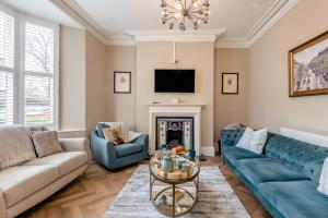 a living room with a couch and a fireplace at 6 Bed in Buxton oc-s31063 in Buxton