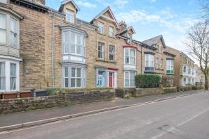 a row of brick houses on a city street at 6 Bed in Buxton oc-s31063 in Buxton