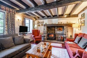 a living room with a couch and a fireplace at 7 Bed in Talgarth oc-h30349 in Talgarth