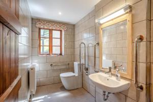 a bathroom with a sink and a toilet and a mirror at 7 Bed in Talgarth oc-h30349 in Talgarth +37 photos