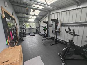 a gym with several treadmills and machines in it at 2 Bed in Newtonmore oc-e32418 in Newtonmore +22 photos