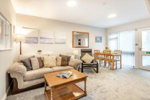 a living room with a couch and a table at 2 Bed in Grasmere oc-ld175 in Grasmere